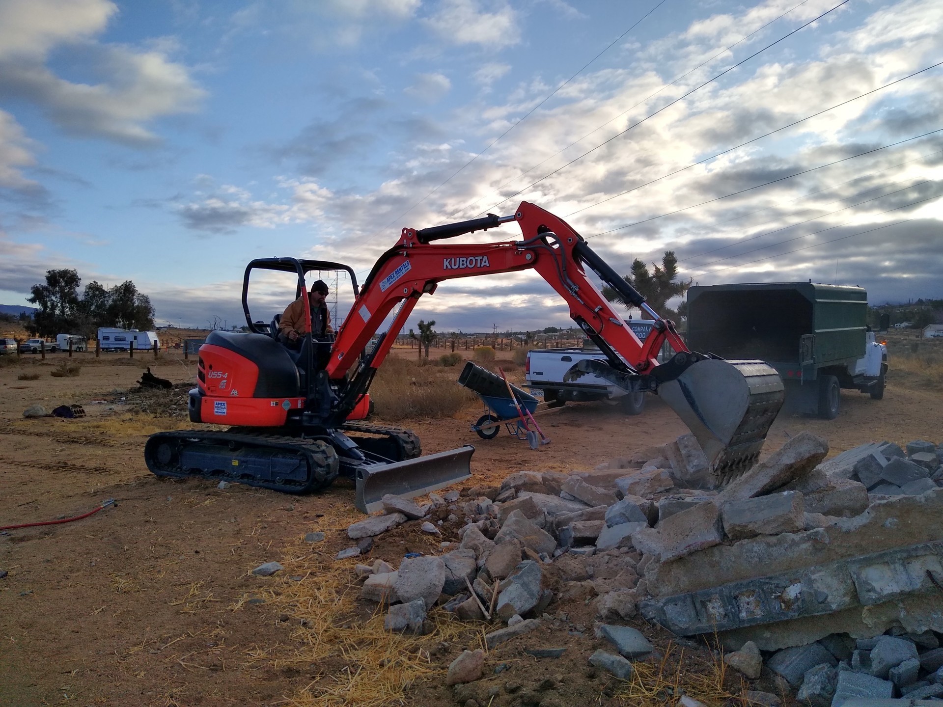 Big CAT Excavator Cleaning Up A Junk Pile